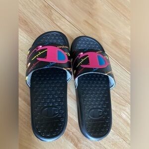 4/$25 Champion slides in 4Y. Black with pink, blue & yellow accents